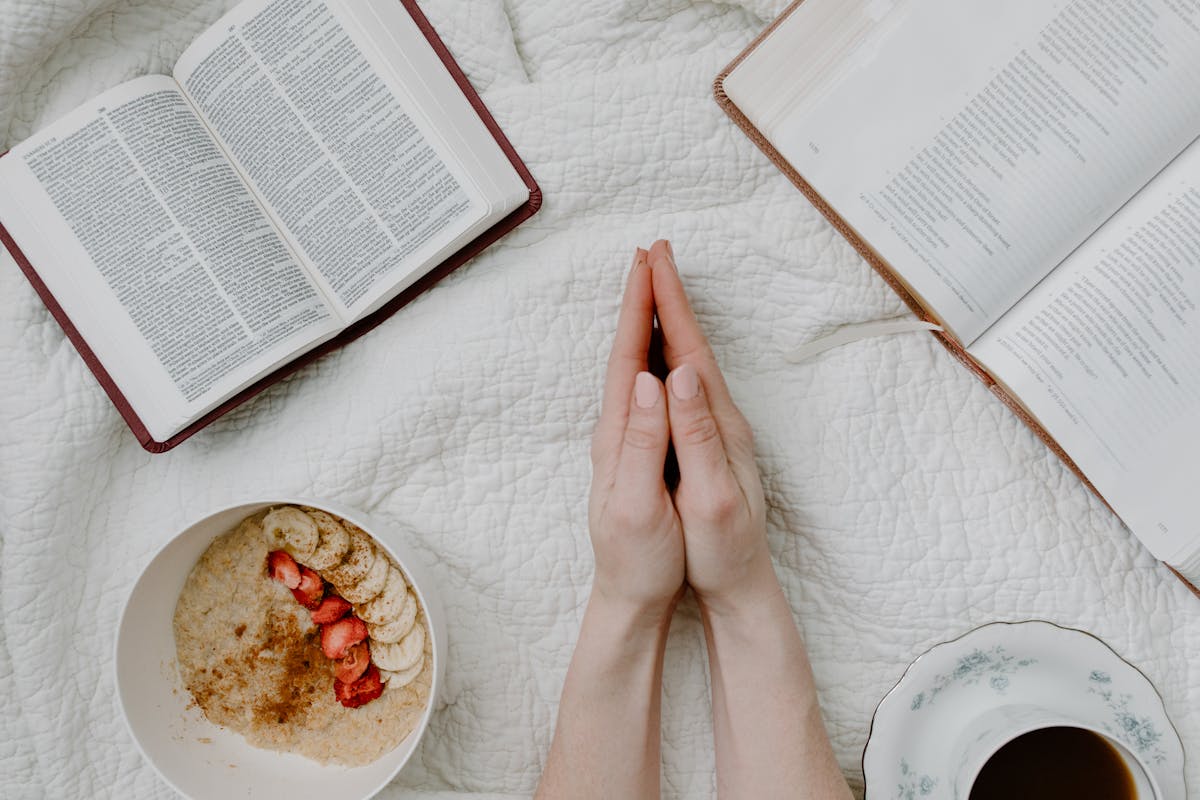 Open Bible and candle for morning prayer
